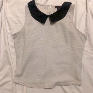 White sleeveless crop top with black colar